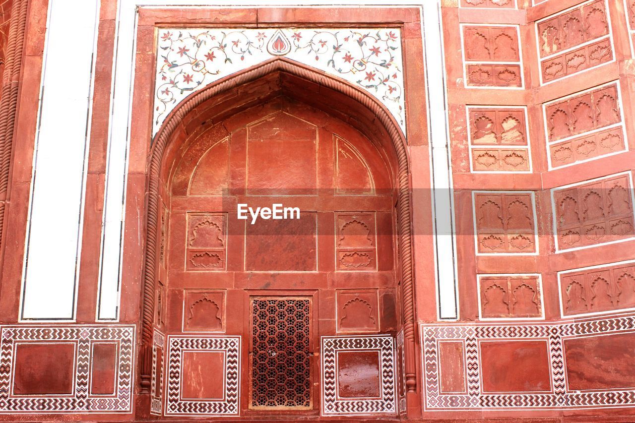 CLOSE-UP OF DOOR OF ORNATE BUILDING