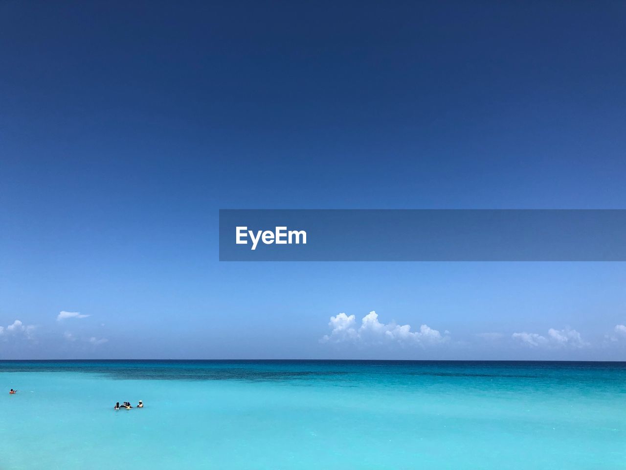 Scenic view of sea against blue sky