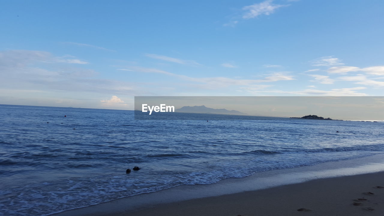 SCENIC VIEW OF SEA AGAINST SKY AT DUSK