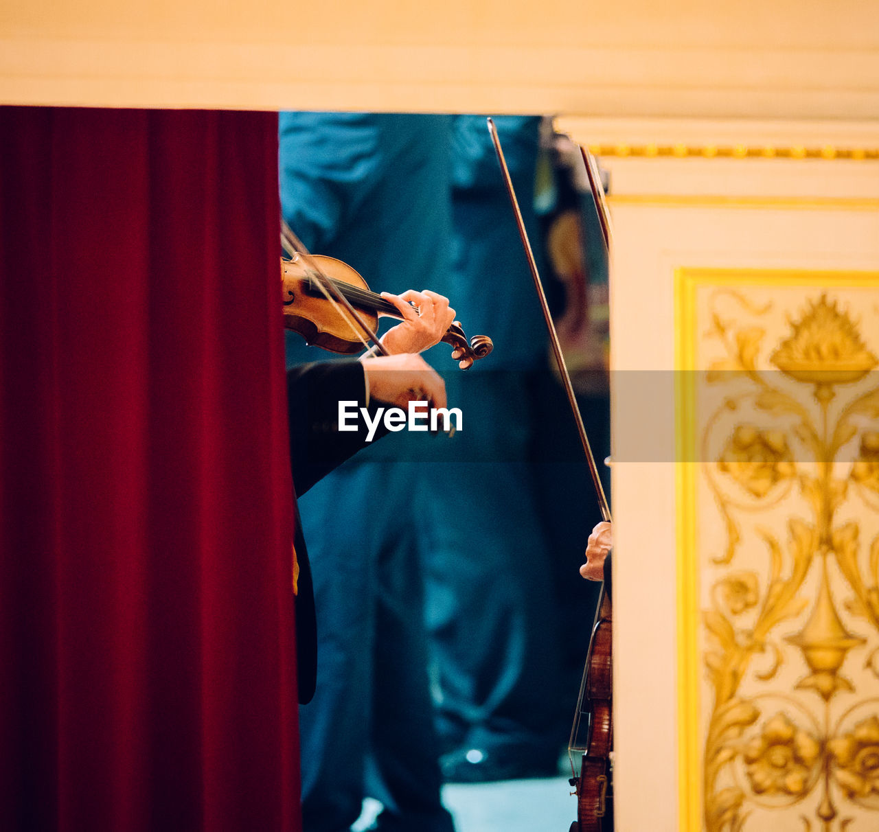 Cropped image of person playing violin