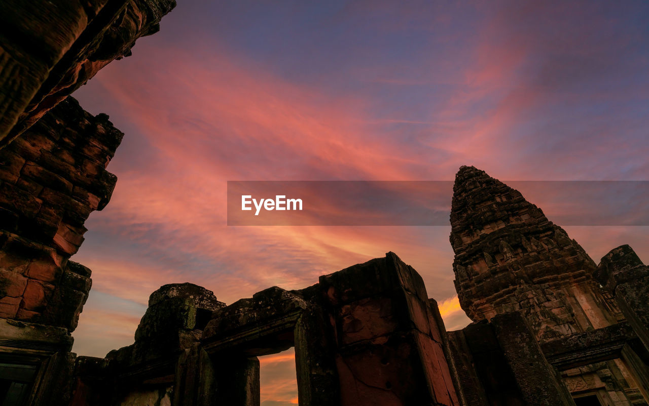 LOW ANGLE VIEW OF TEMPLE DURING SUNSET