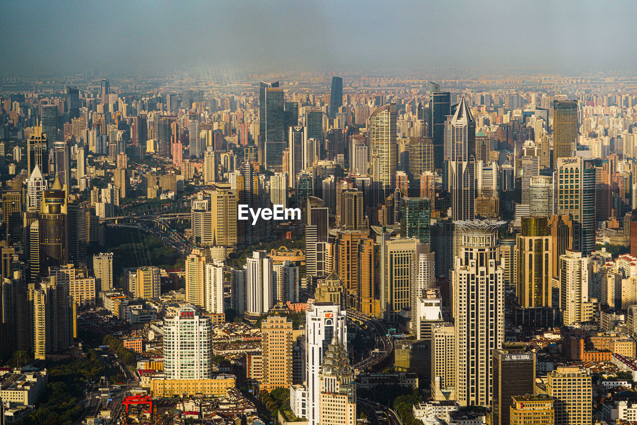 AERIAL VIEW OF CITY BUILDINGS AGAINST SKY