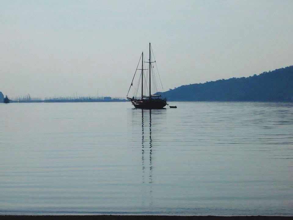 SAILBOAT SAILING IN SEA