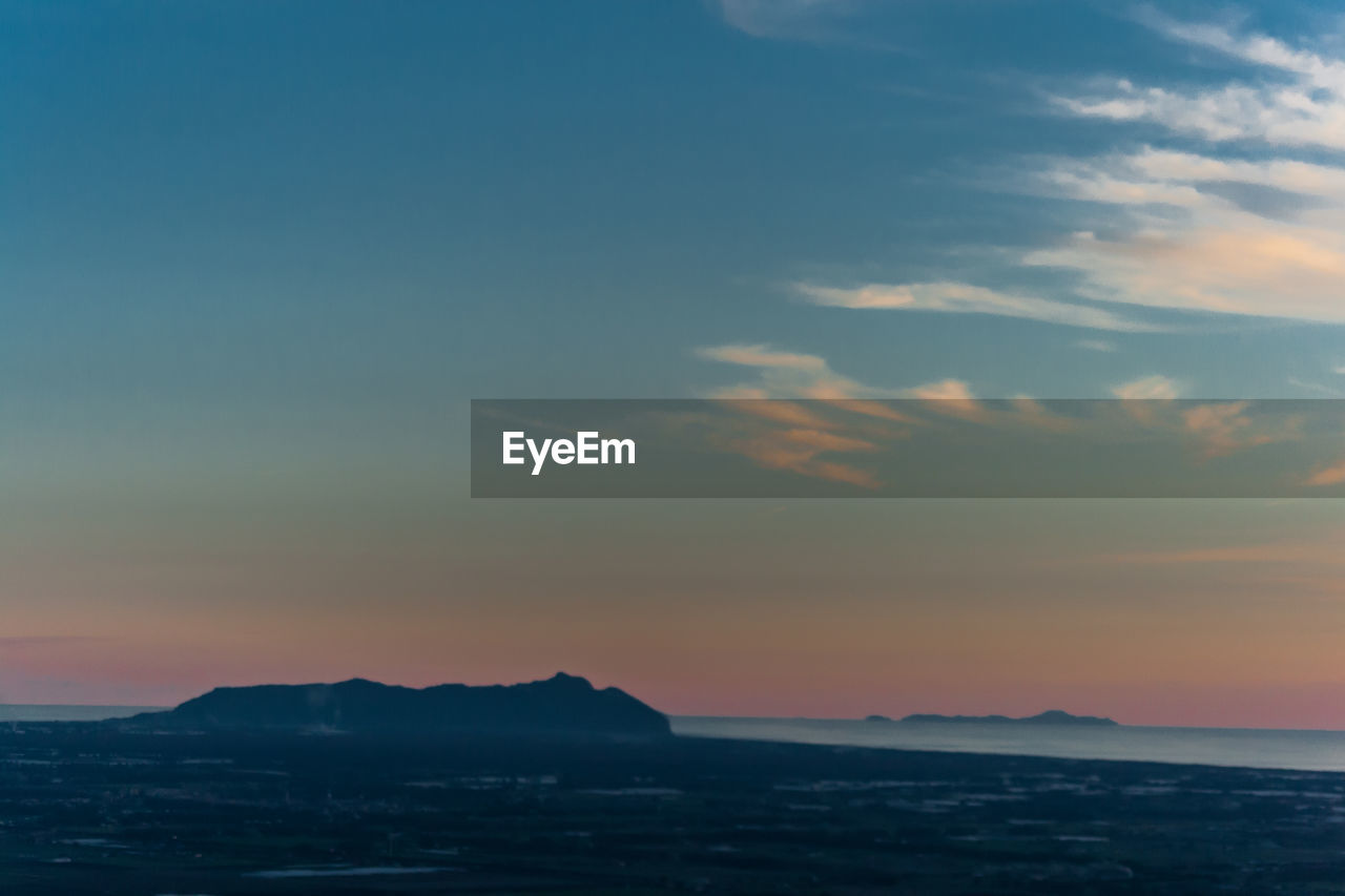 Scenic view of landscape against sky during sunset