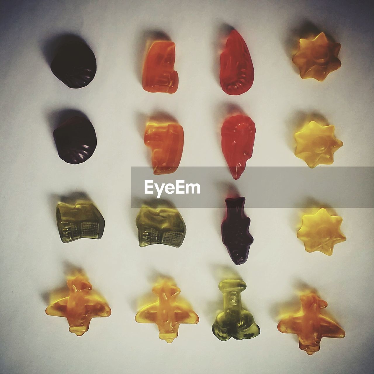 High angle view of various candies on white background