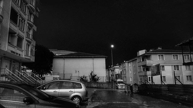 VIEW OF ILLUMINATED STREET AT NIGHT
