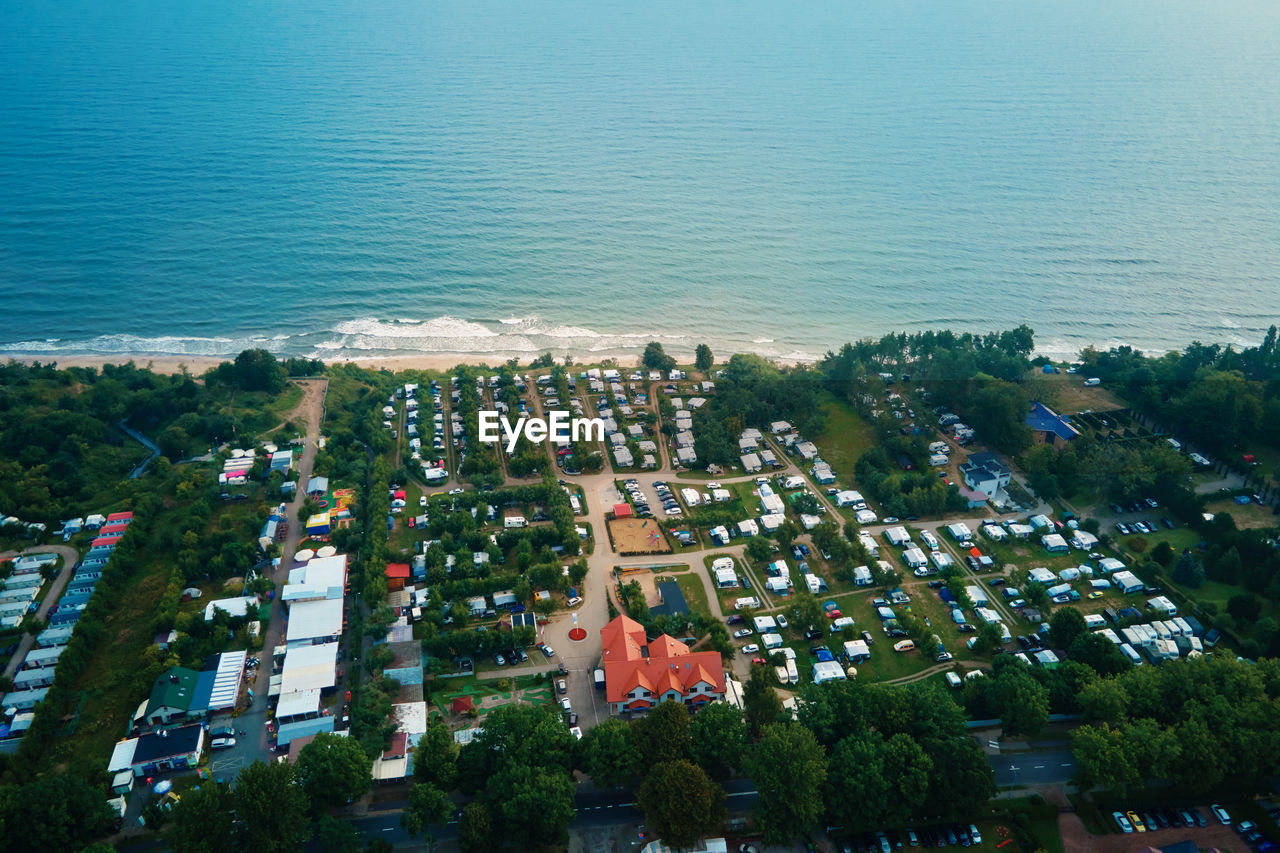 Aerial view of campsite with trailers near baltic sea beach in wladyslawowo, poland