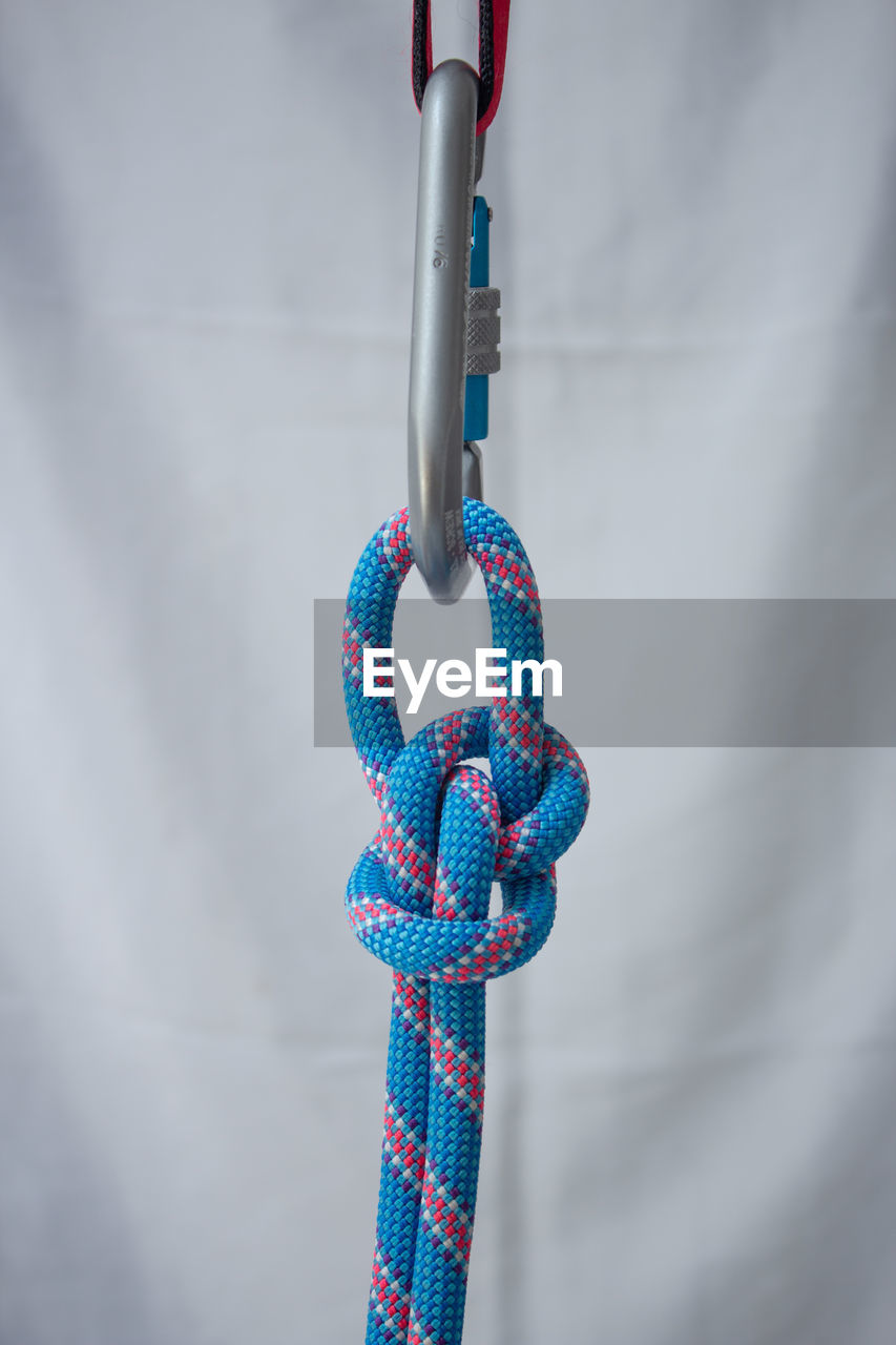 Bowline knot tied with a climbing rope to a pear shaped locking carabiner