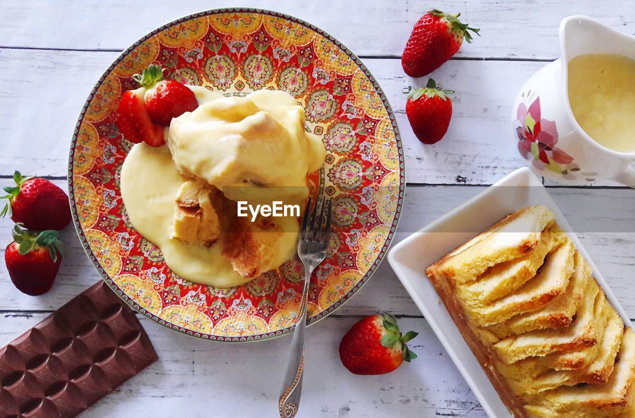 Directly above shot of dessert in plates on table