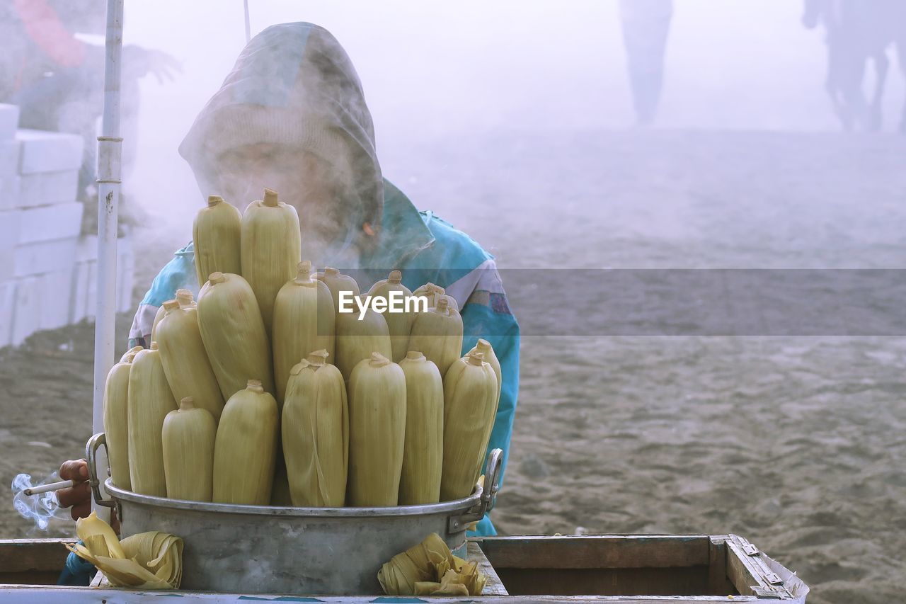 Man standing by corns