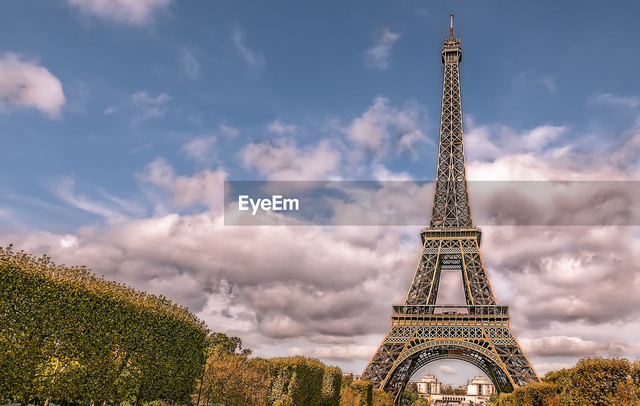 Low angle view of tower against cloudy sky