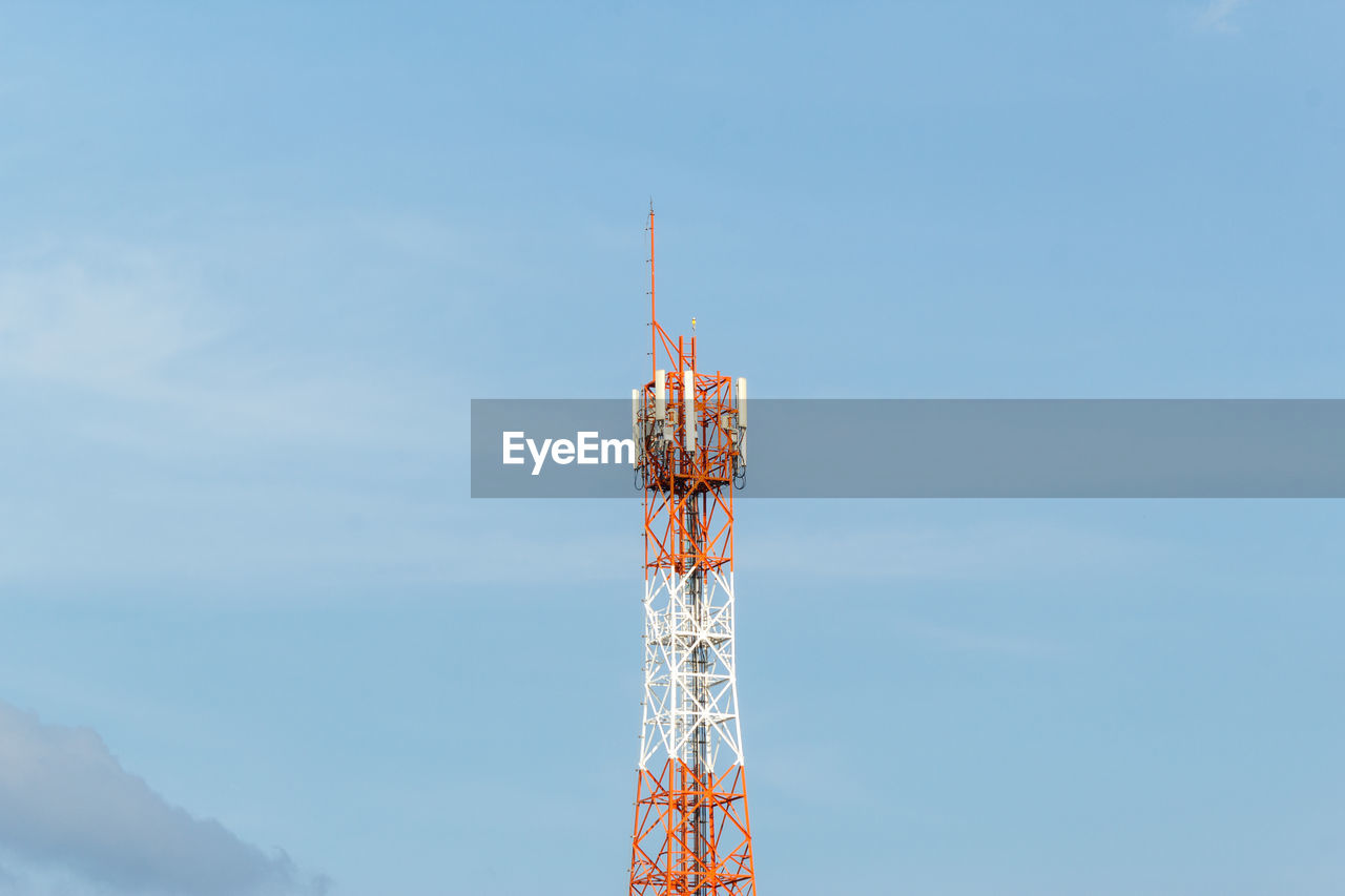 Low angle view of communications tower against sky