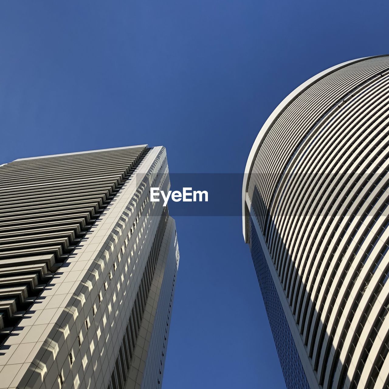 LOW ANGLE VIEW OF BUILDINGS AGAINST CLEAR SKY