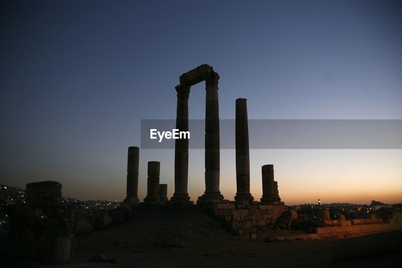 Temple of hercules against clear sky at dusk