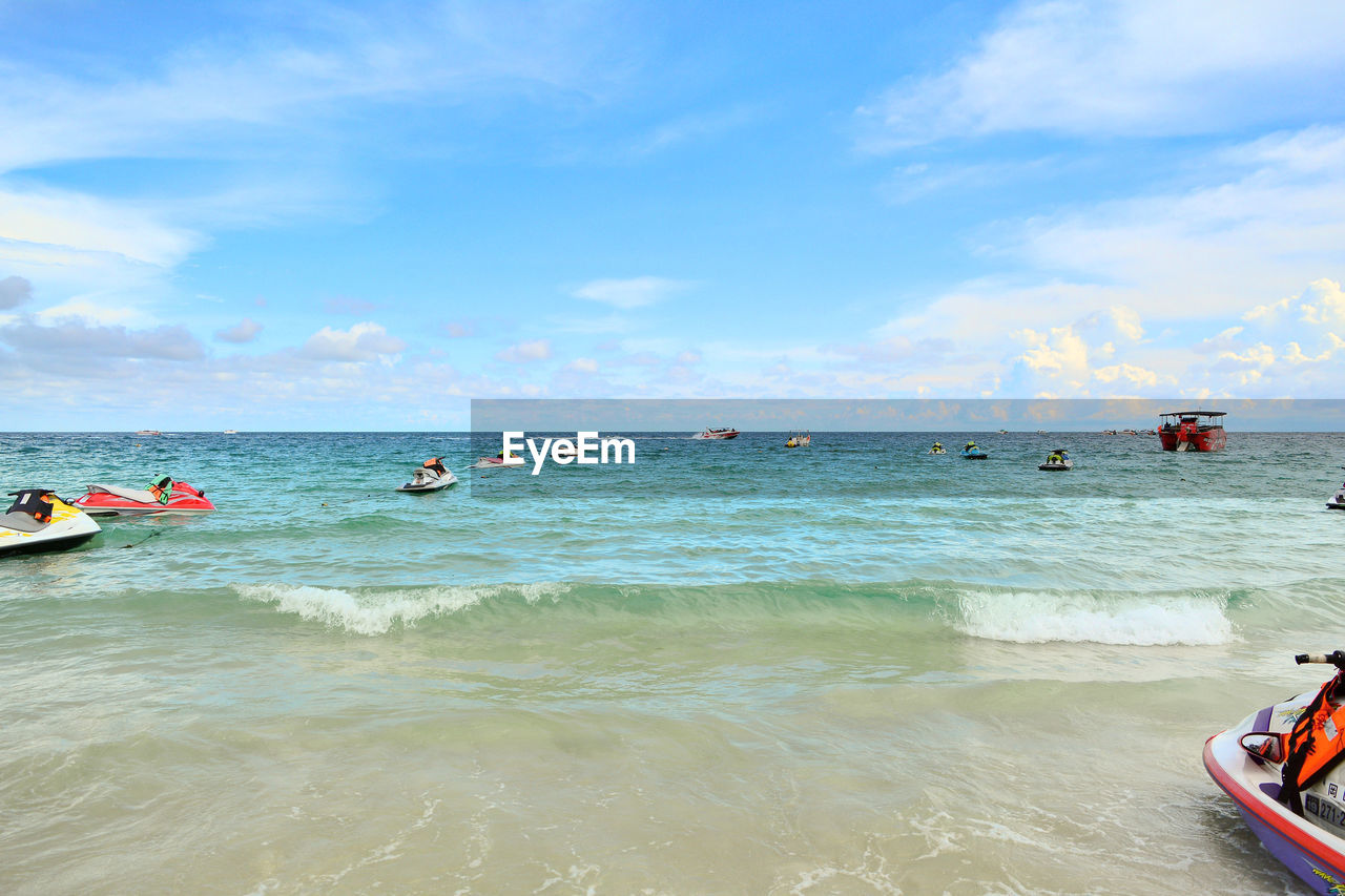 PANORAMIC VIEW OF PEOPLE ON BEACH
