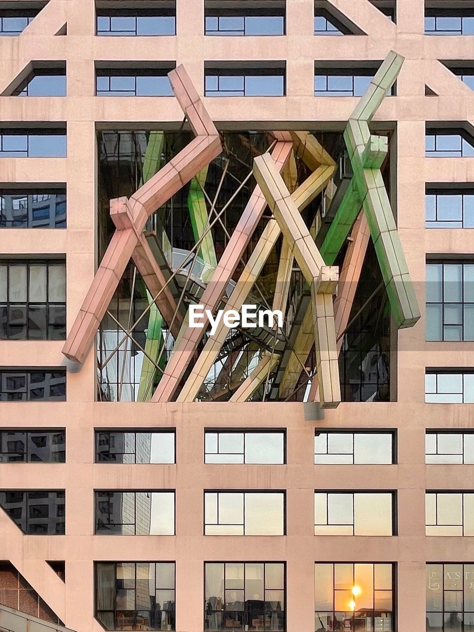 LOW ANGLE VIEW OF BUILDING WITH WINDOWS