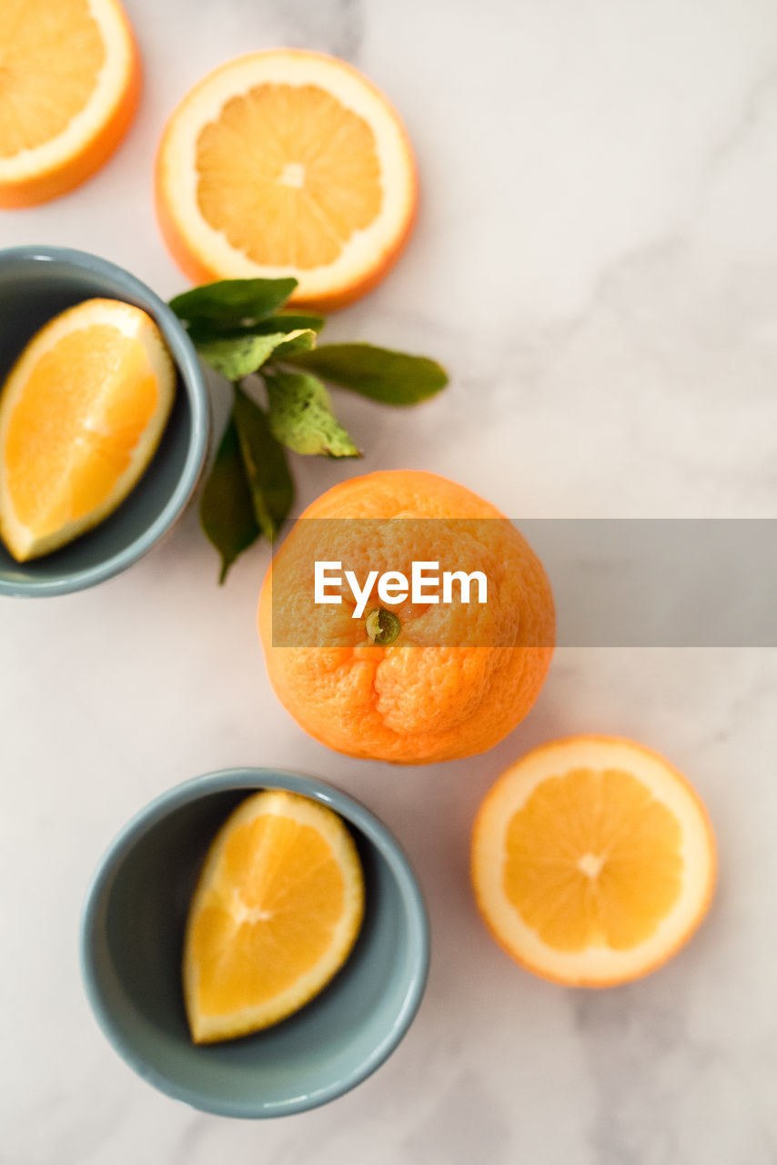 Flatlay of citrus oranges on white