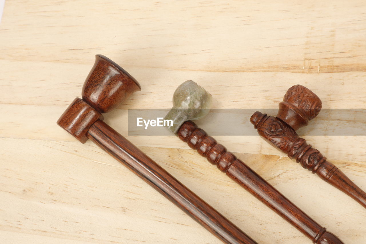 high angle view of knife on wooden table