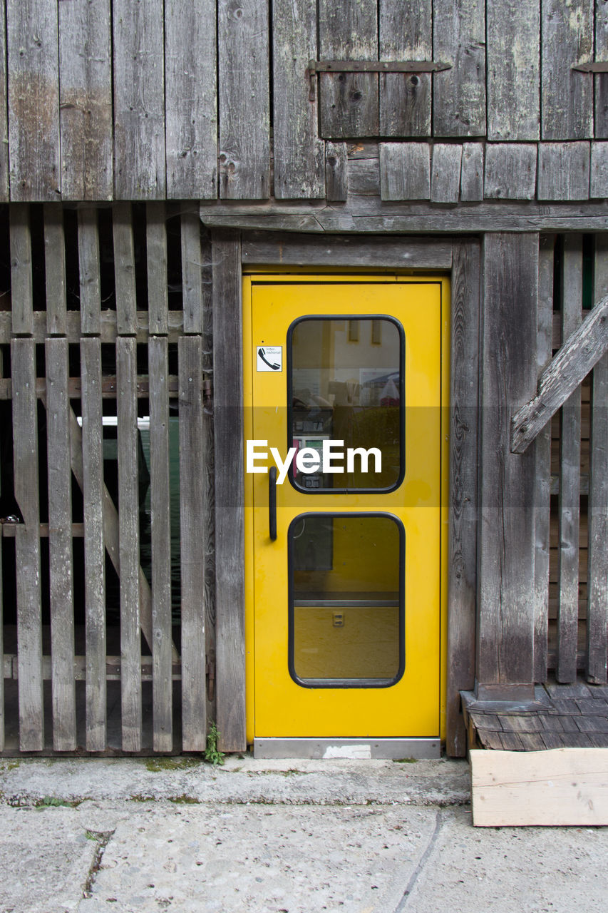 YELLOW DOOR WITH CLOSED DOORS