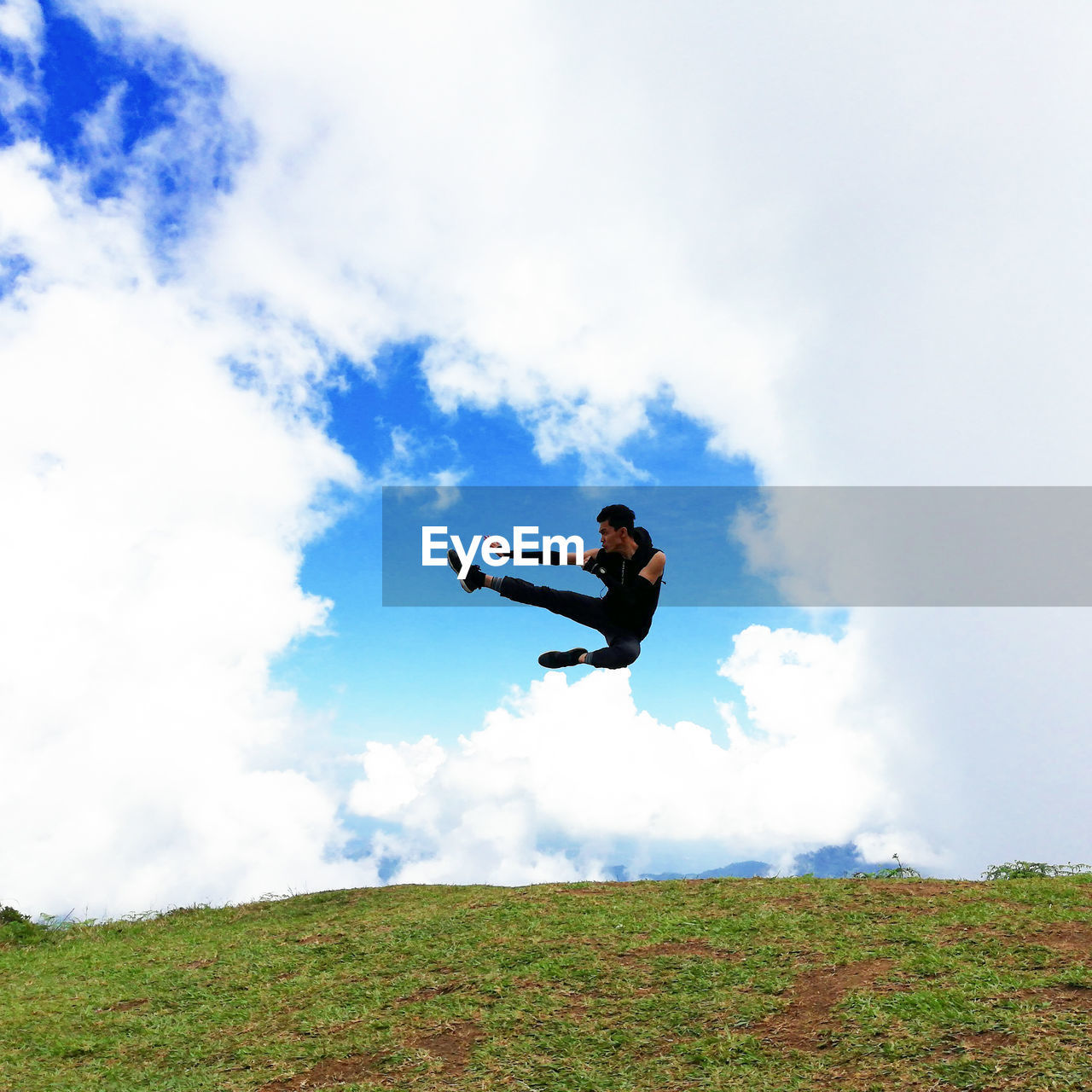 MAN JUMPING ON FIELD