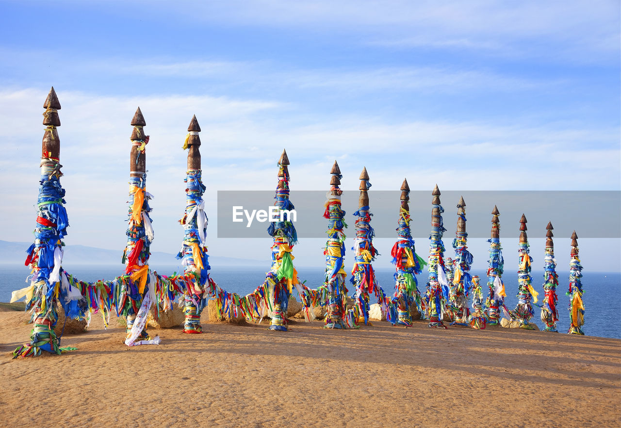 PANORAMIC VIEW OF MULTI COLORED UMBRELLAS ON THE BEACH