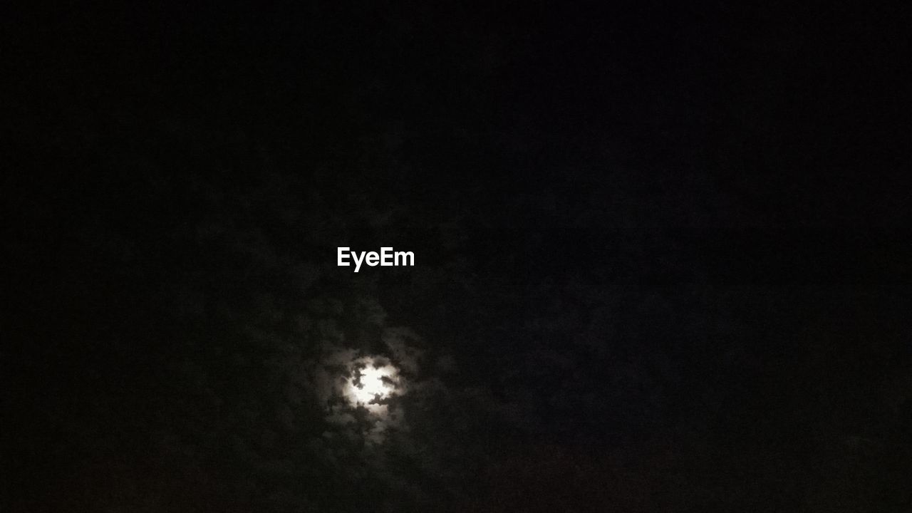 LOW ANGLE VIEW OF MOON IN THE SKY