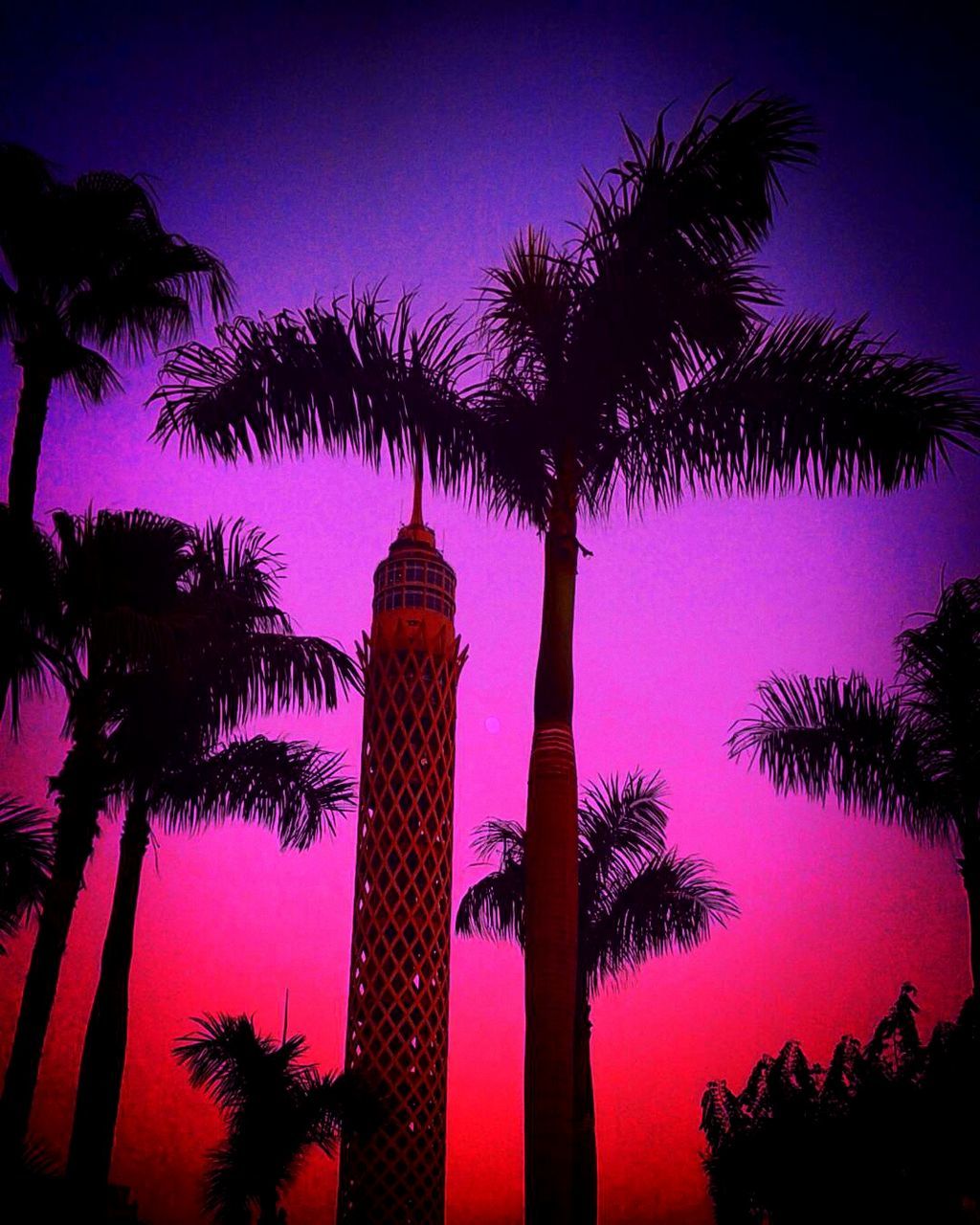 LOW ANGLE VIEW OF TOWER AT NIGHT