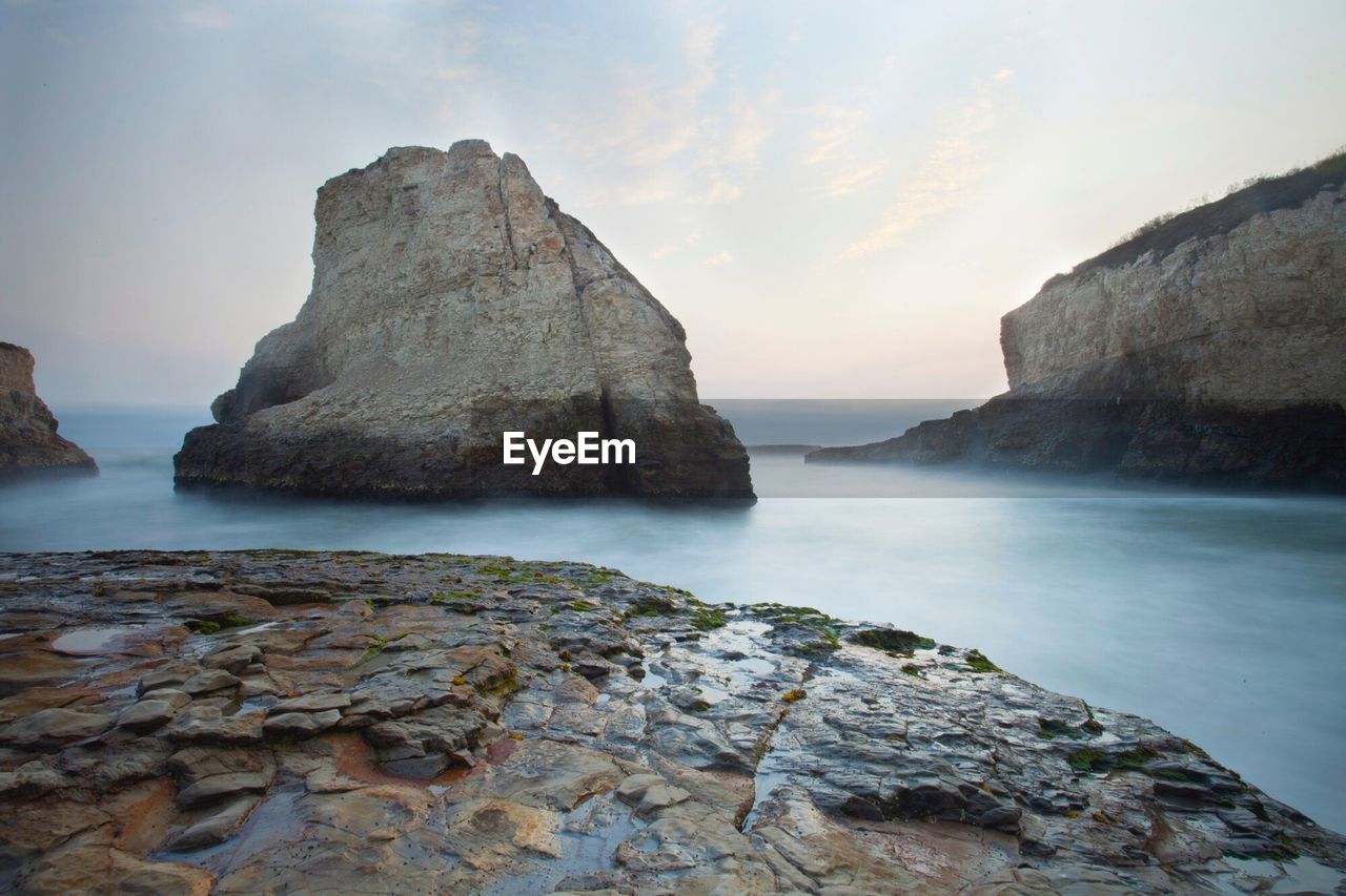 Scenic view of sea against cloudy sky