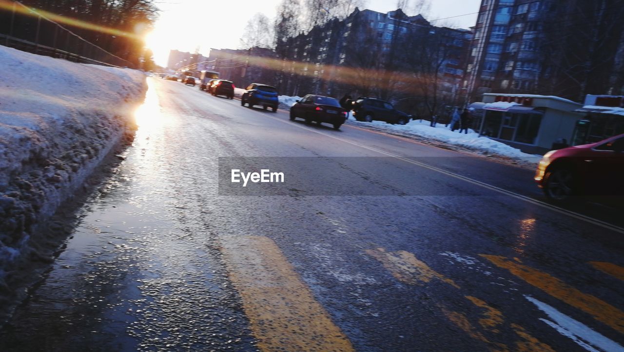 VEHICLES ON ROAD IN WINTER