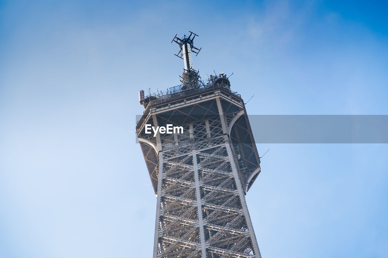 LOW ANGLE VIEW OF A BUILDING AGAINST BLUE SKY