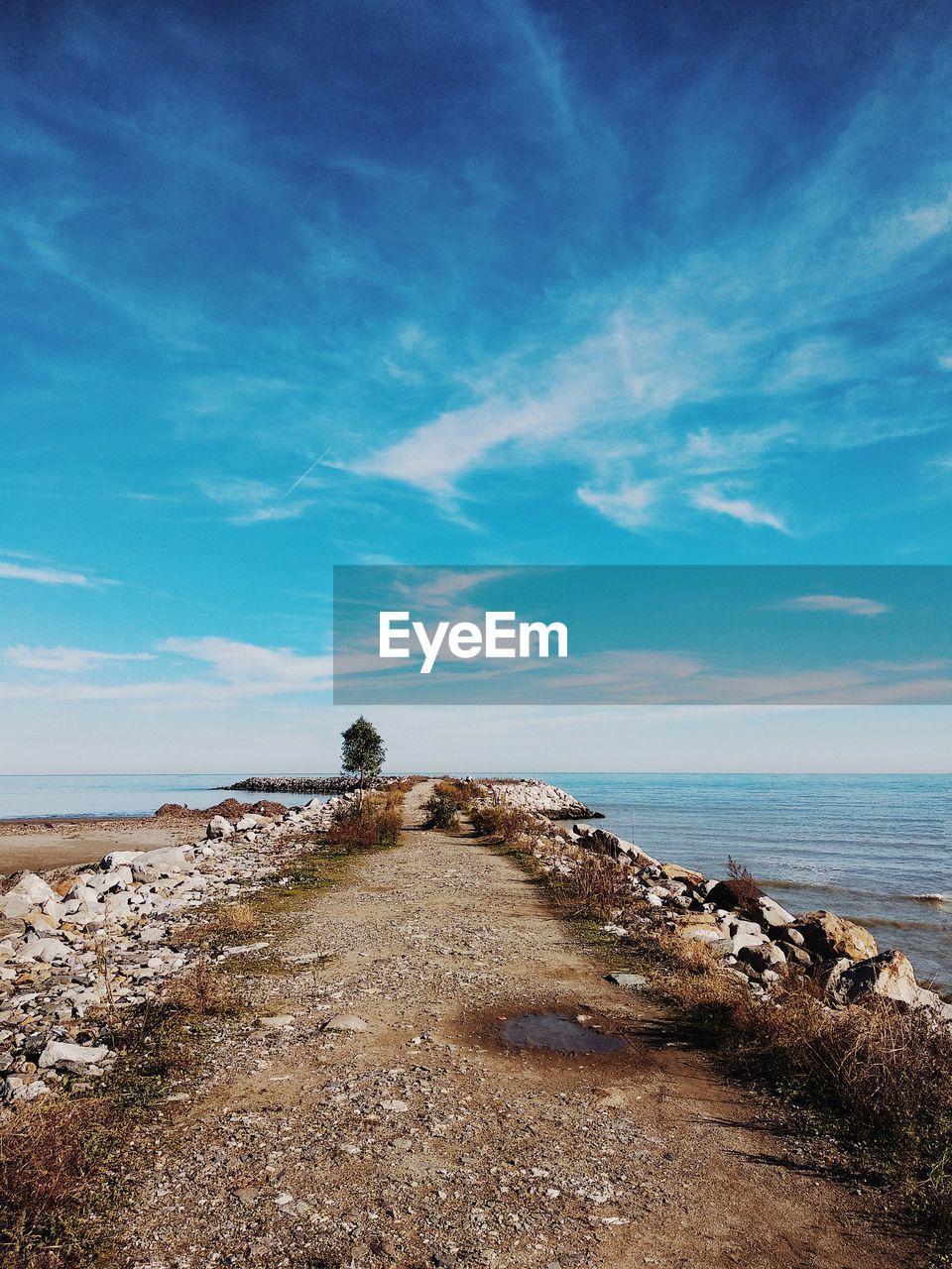 Scenic view of sea against blue sky