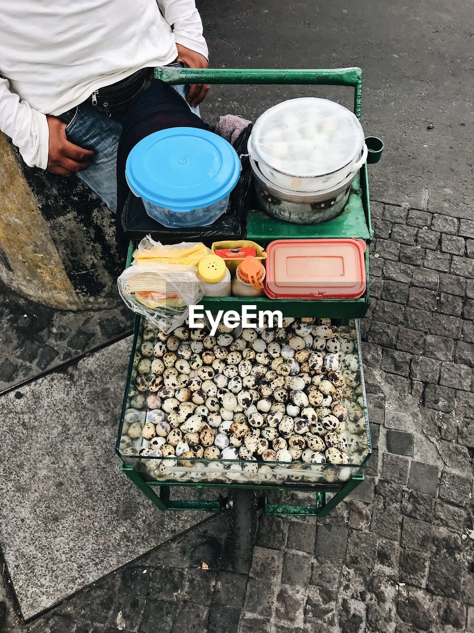 HIGH ANGLE VIEW OF MAN WORKING IN CONTAINER