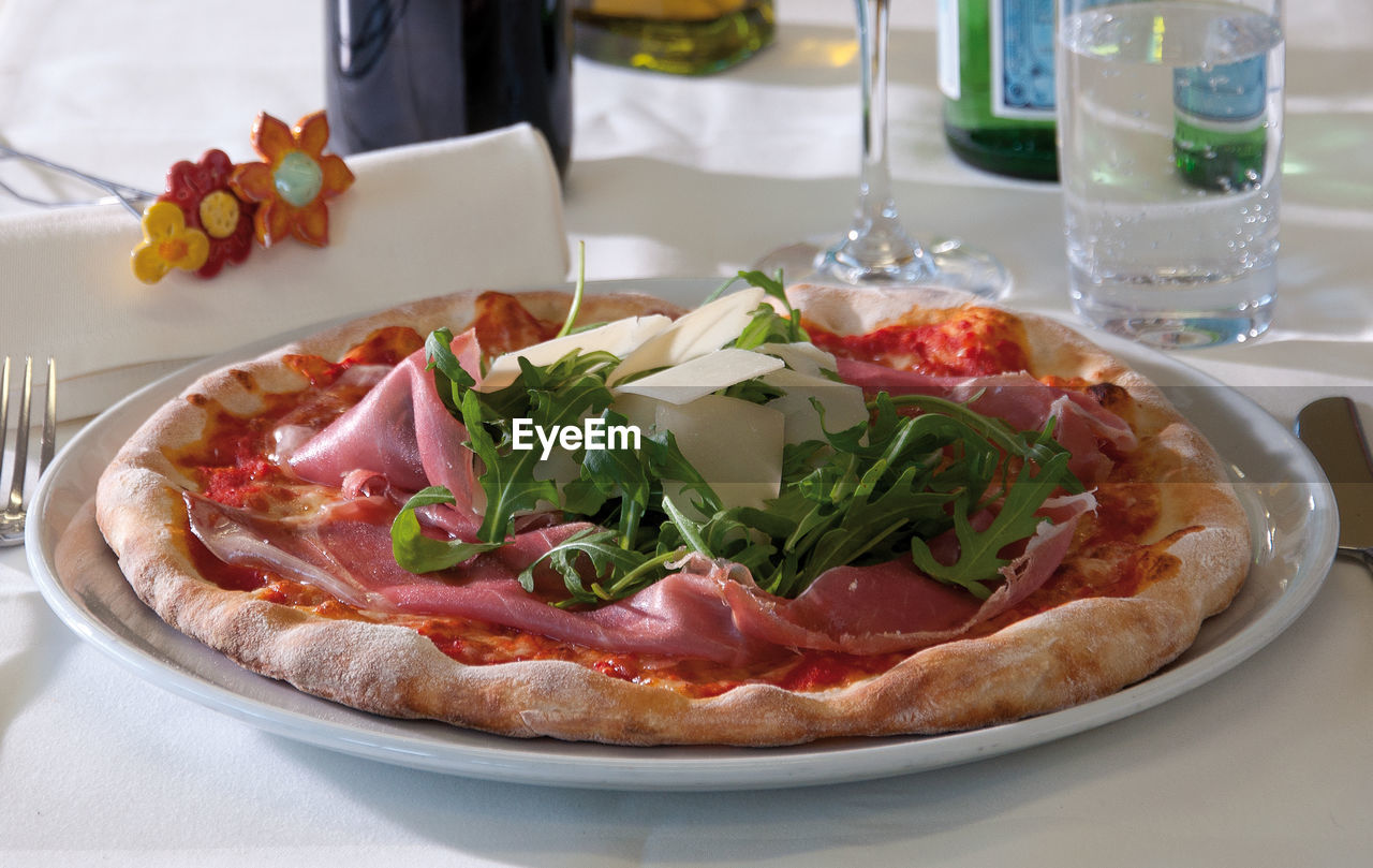 Close-up of pizza served on table