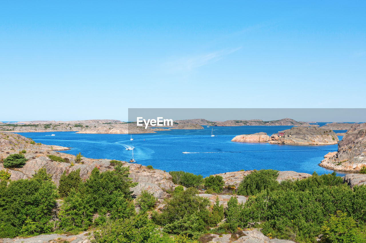 Scenic view of sea against blue sky