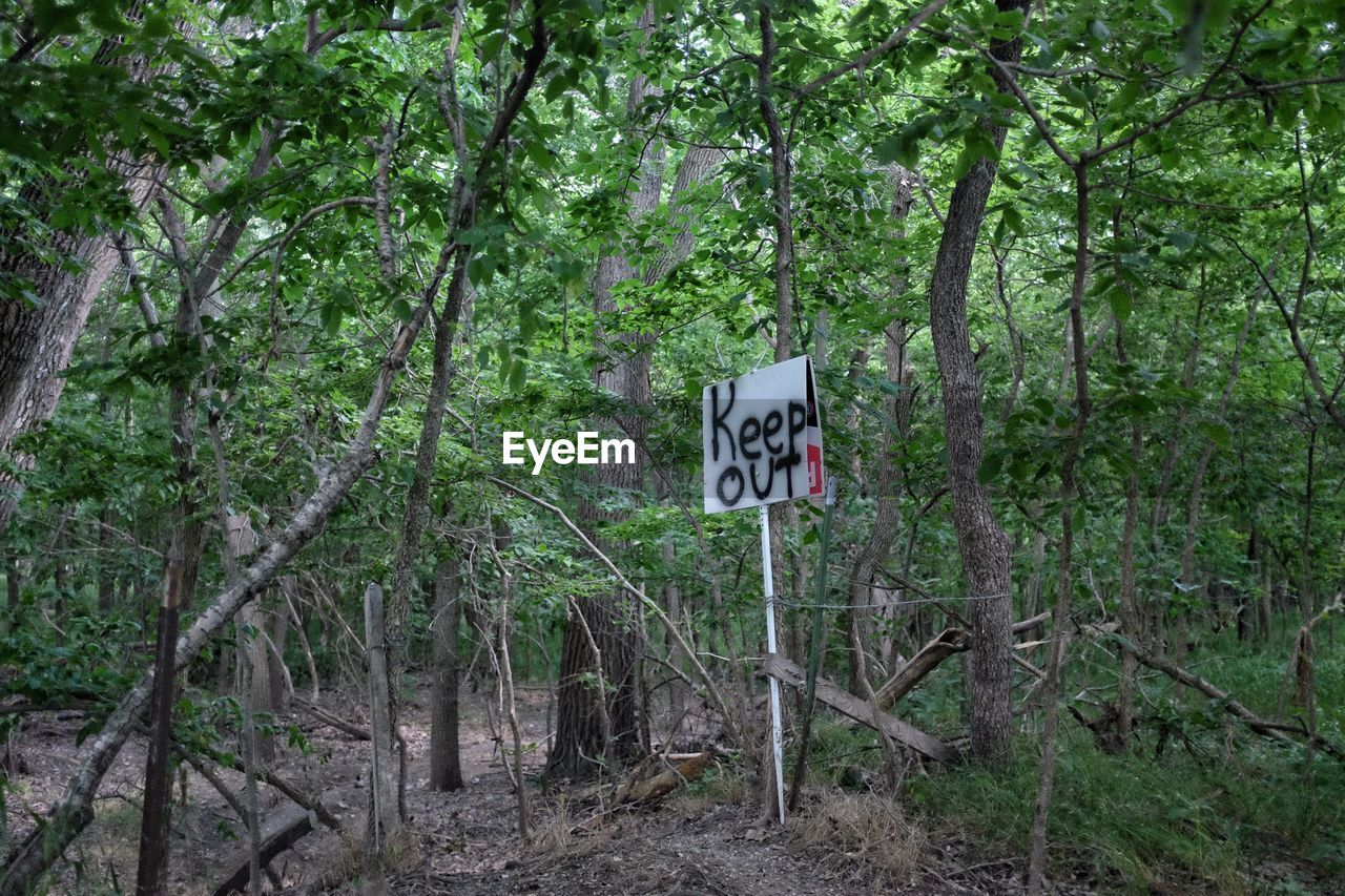 Keep out signboard in forest