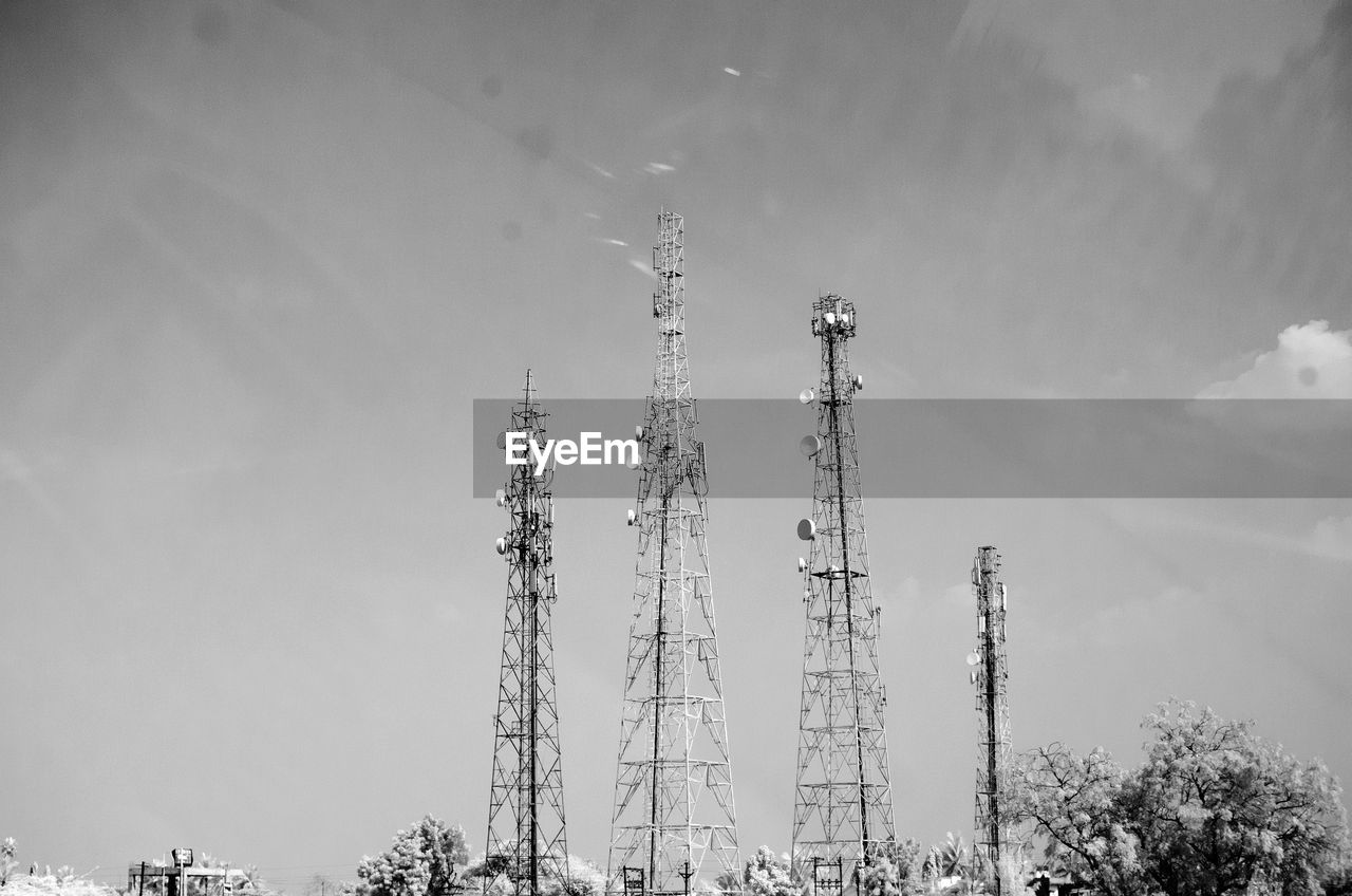 Communications towers against sky