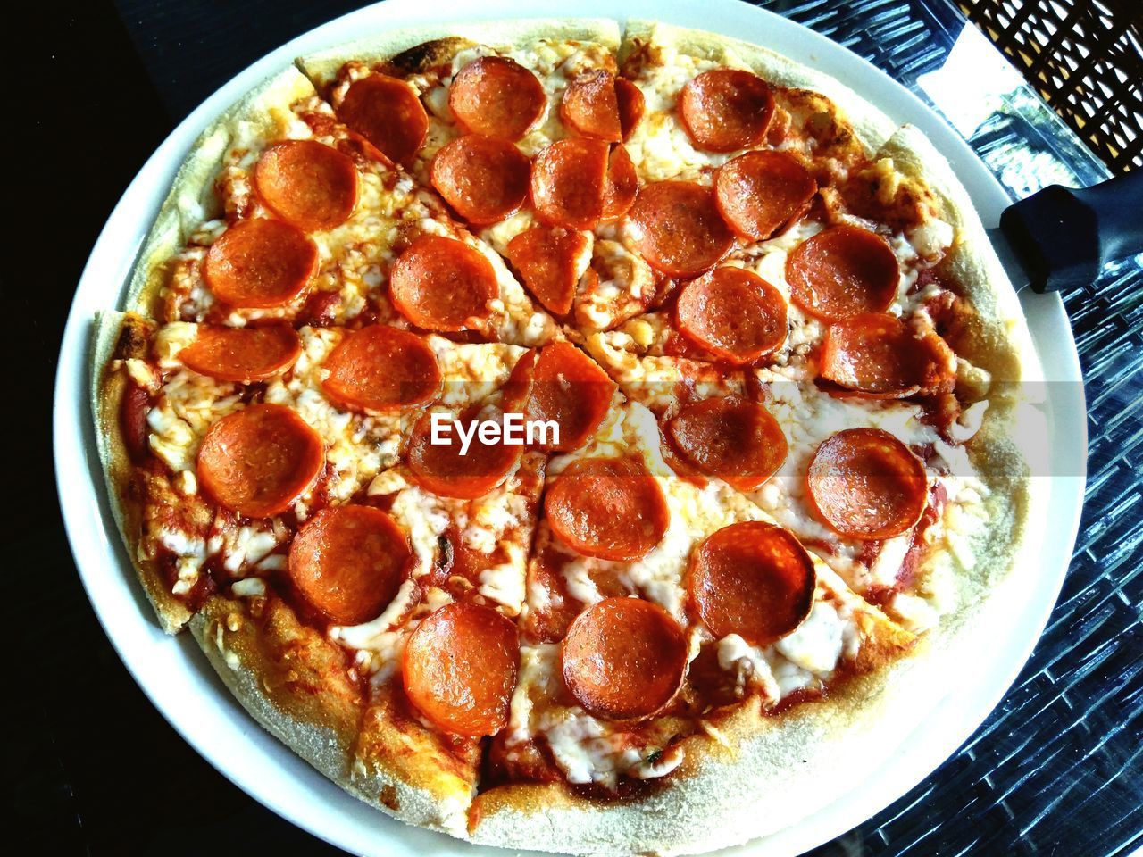 CLOSE-UP OF PIZZA WITH ICE CREAM