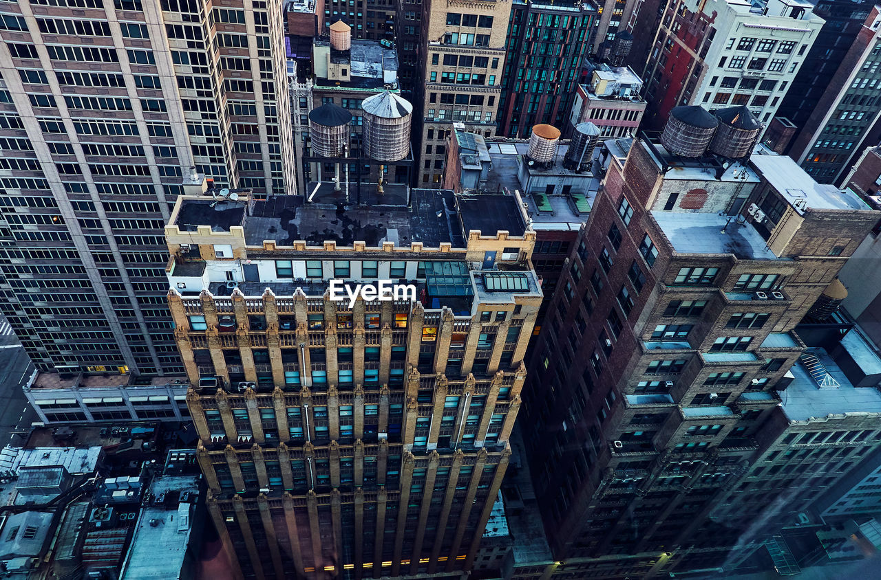 High angle view of modern buildings in city of manhattan