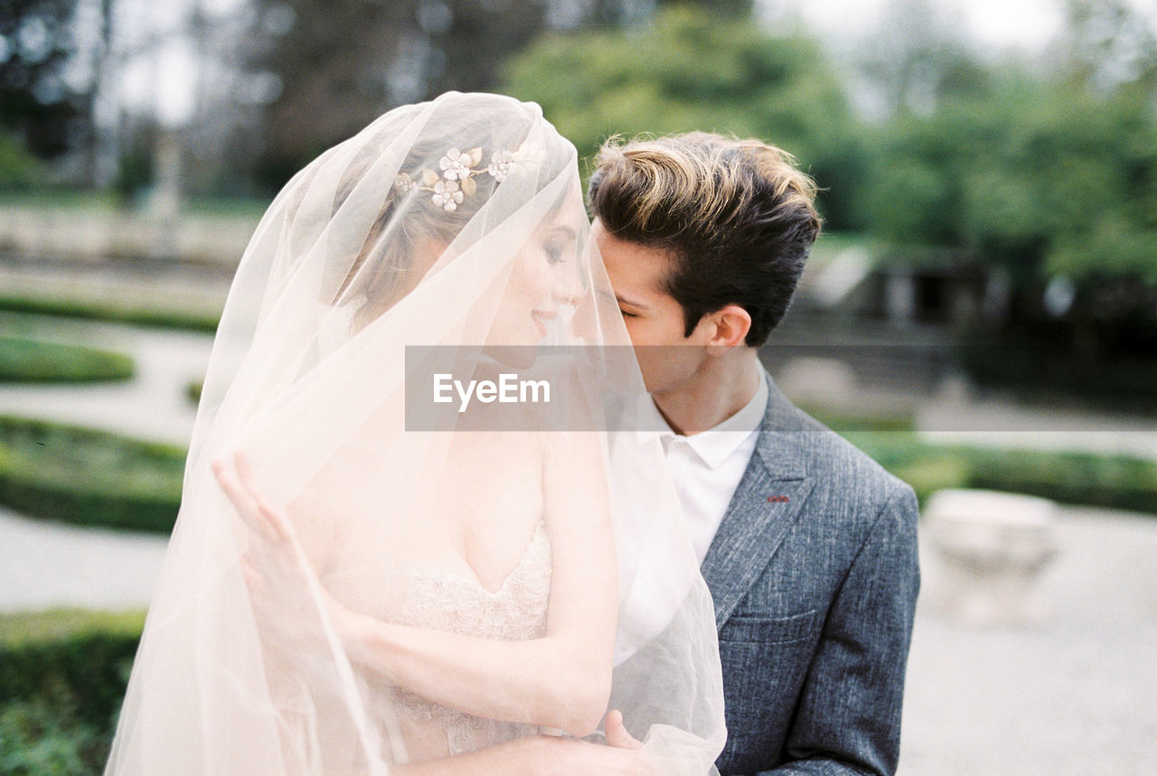 rear view of couple with bouquet