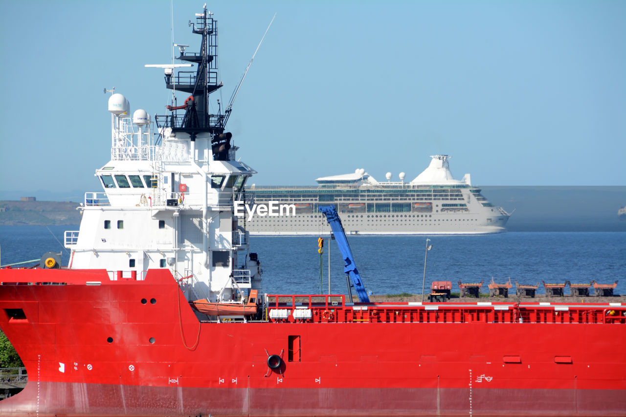 Ship moored on sea against sky