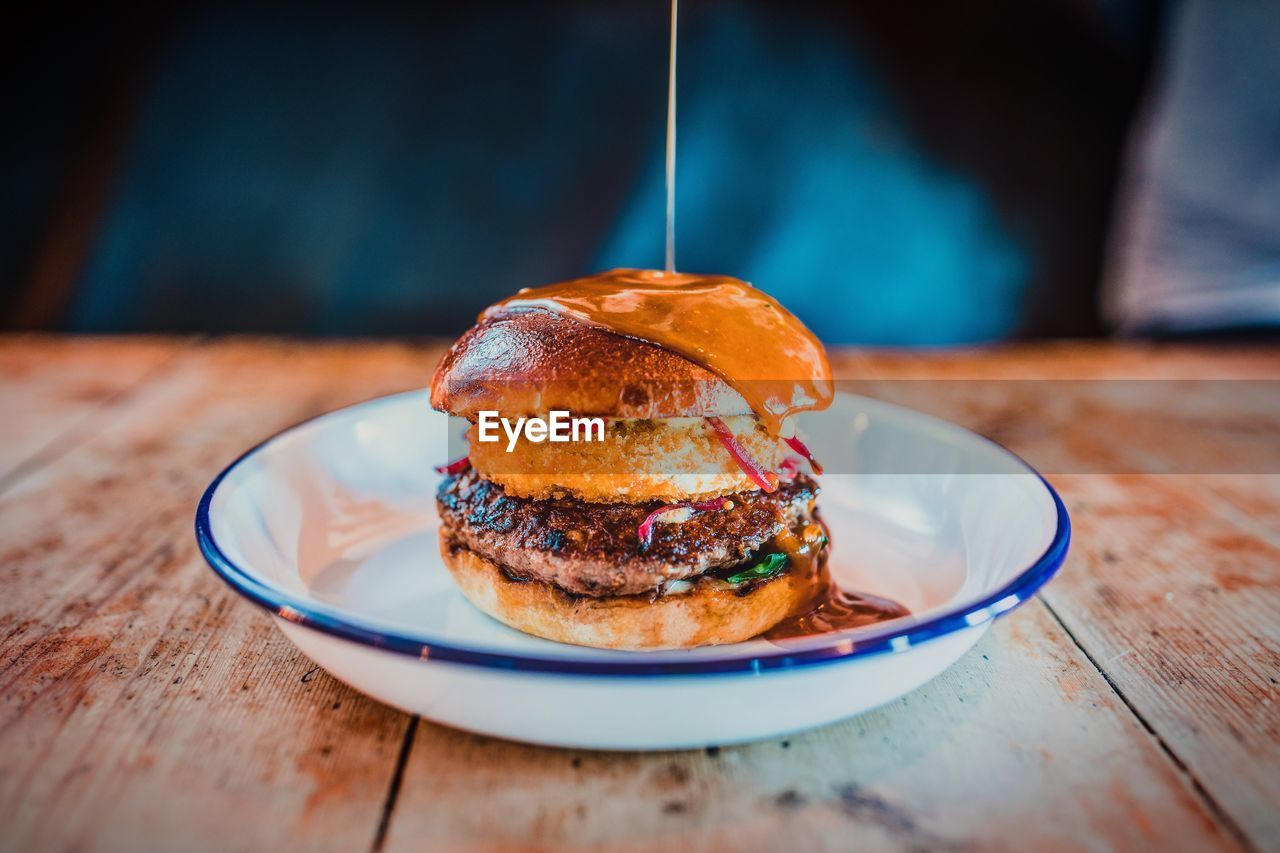 Close-up of burger in plate on table