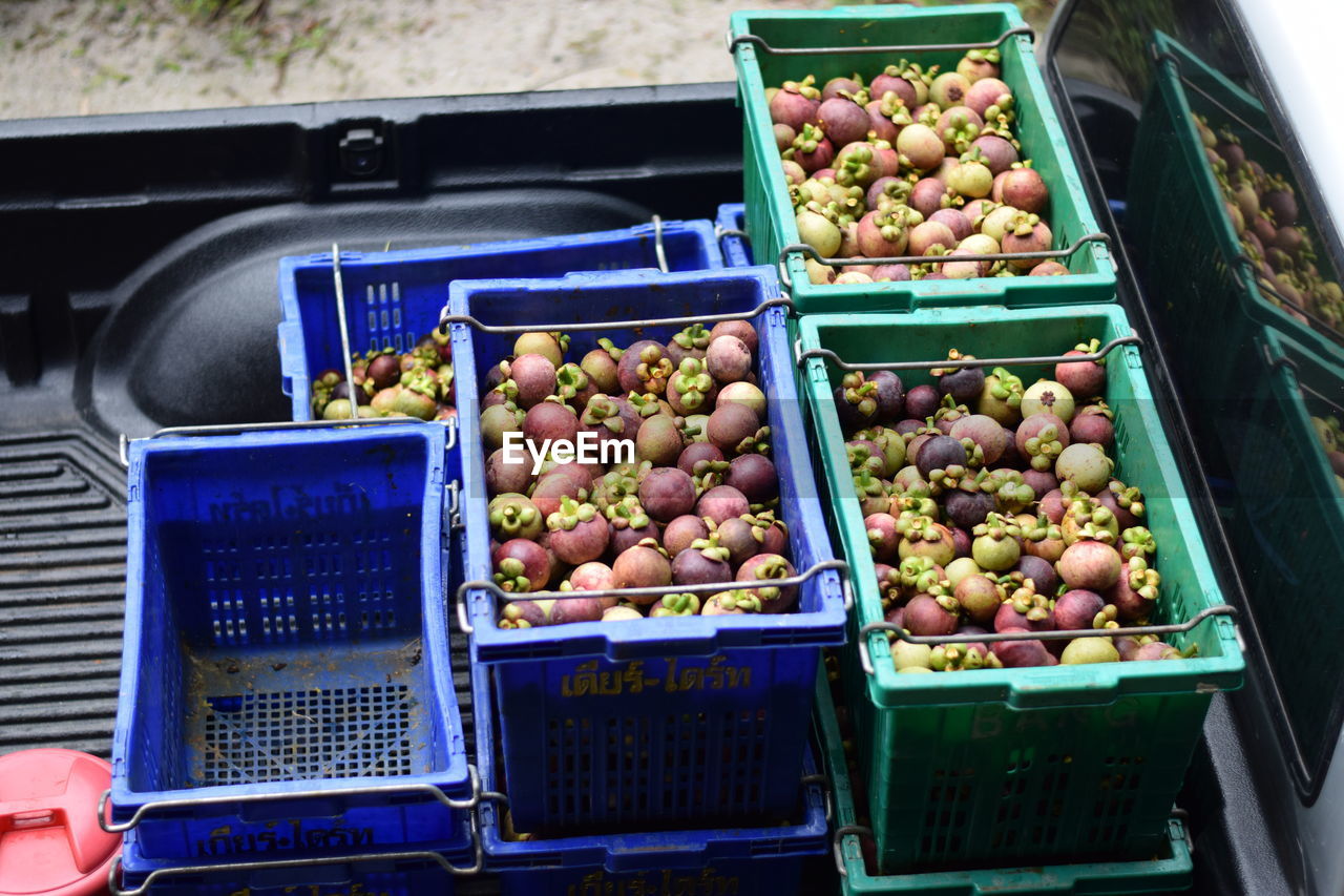 HIGH ANGLE VIEW OF FRUITS FOR SALE IN MARKET STALL