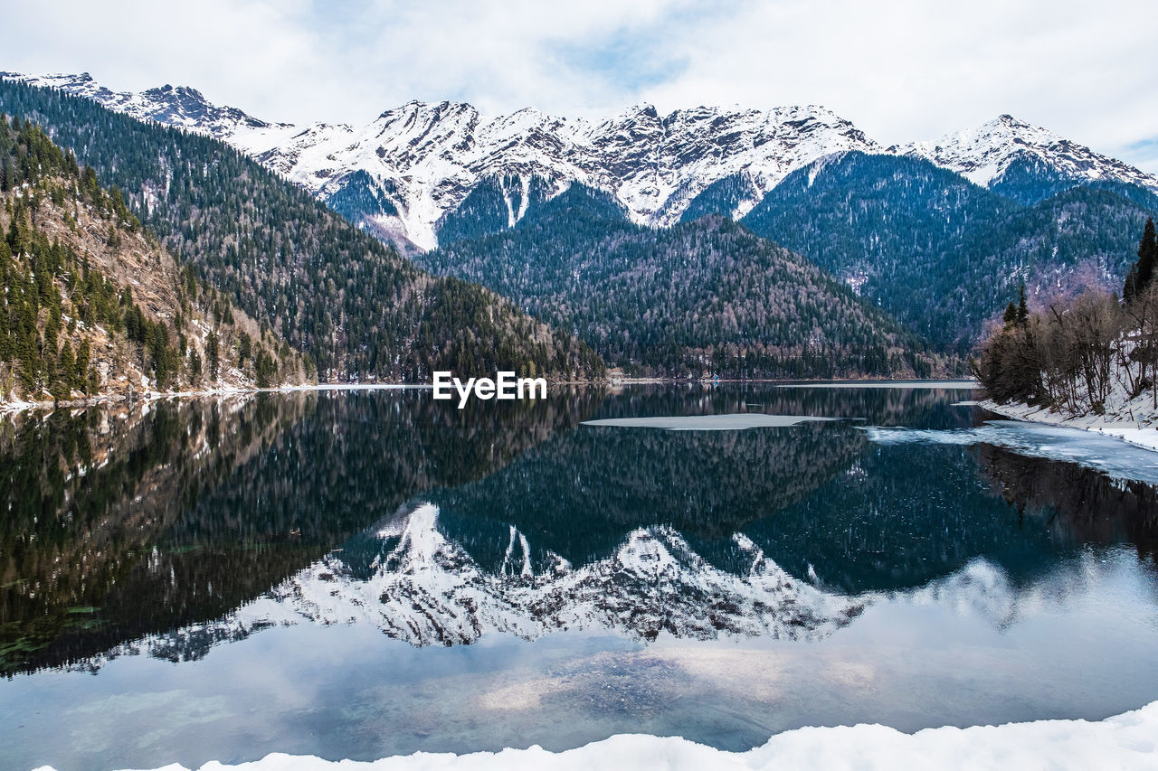 Mountain landscape. lake ritsa in the spring season. located in abkhazia, in the caucasus mountains.