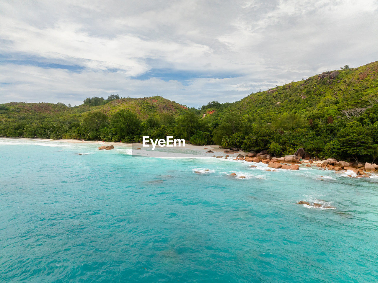 water, sea, land, beach, scenics - nature, sky, beauty in nature, nature, travel destinations, travel, environment, vacation, trip, island, holiday, tree, coastline, tourism, cloud, tranquility, landscape, idyllic, tropical climate, turquoise colored, lagoon, tranquil scene, summer, plant, blue, relaxation, nautical vessel, seascape, sand, mountain, outdoors, no people, forest, day, bay, non-urban scene, bay of water, coast, tourist resort, body of water, transportation, social issues, ocean, shore, islet, coral, environmental conservation, reef, water sports, water's edge, swimming, sunlight, luxury, honeymoon, cove