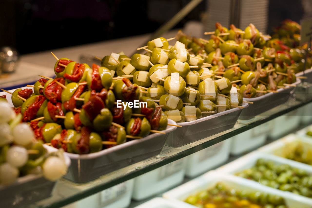High angle view of olives in trays at store