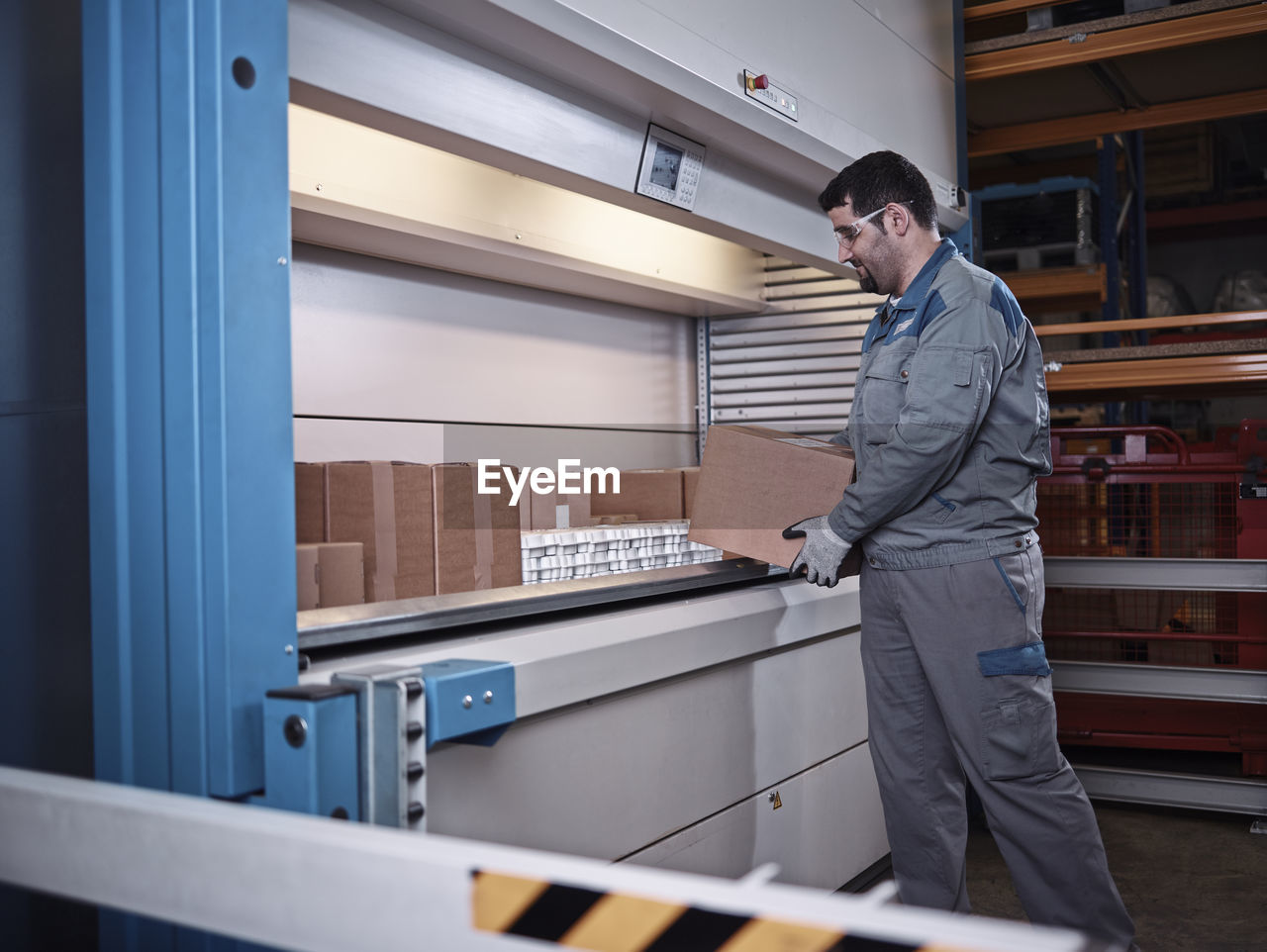 Worker sorting packages