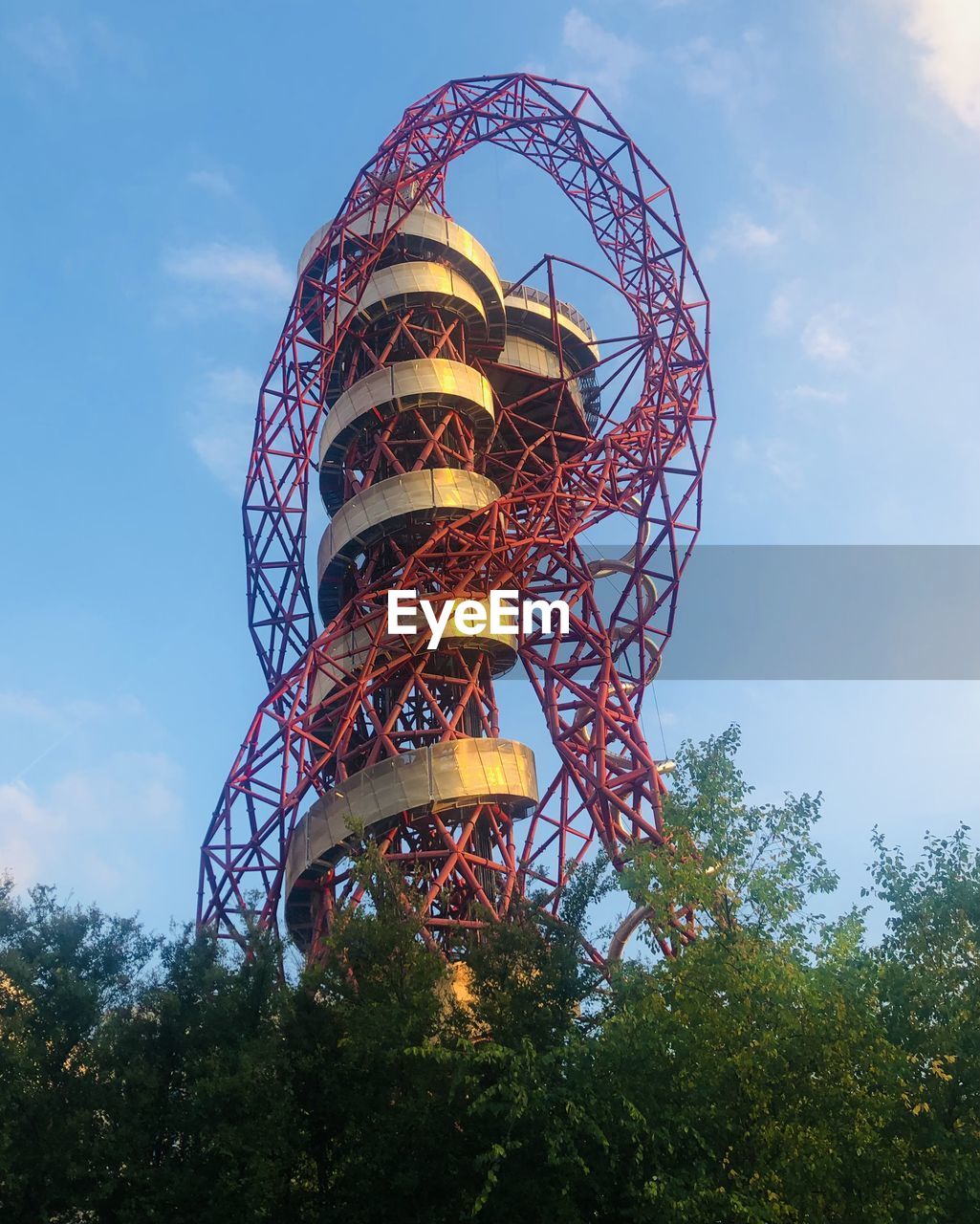 LOW ANGLE VIEW OF FERRIS WHEEL AGAINST BLUE SKY