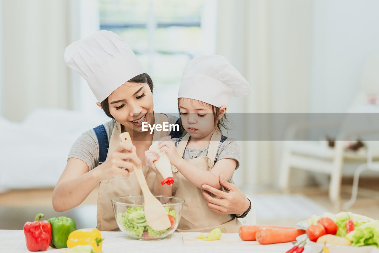 YOUNG WOMAN HOLDING FOOD