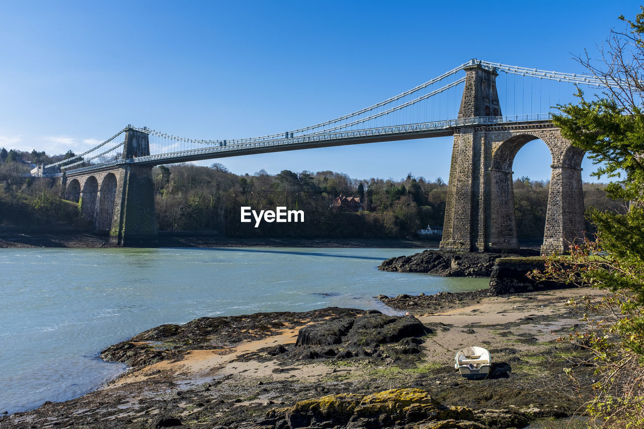 The menai bridge connecting the island of anglesey to the welsh mainland.