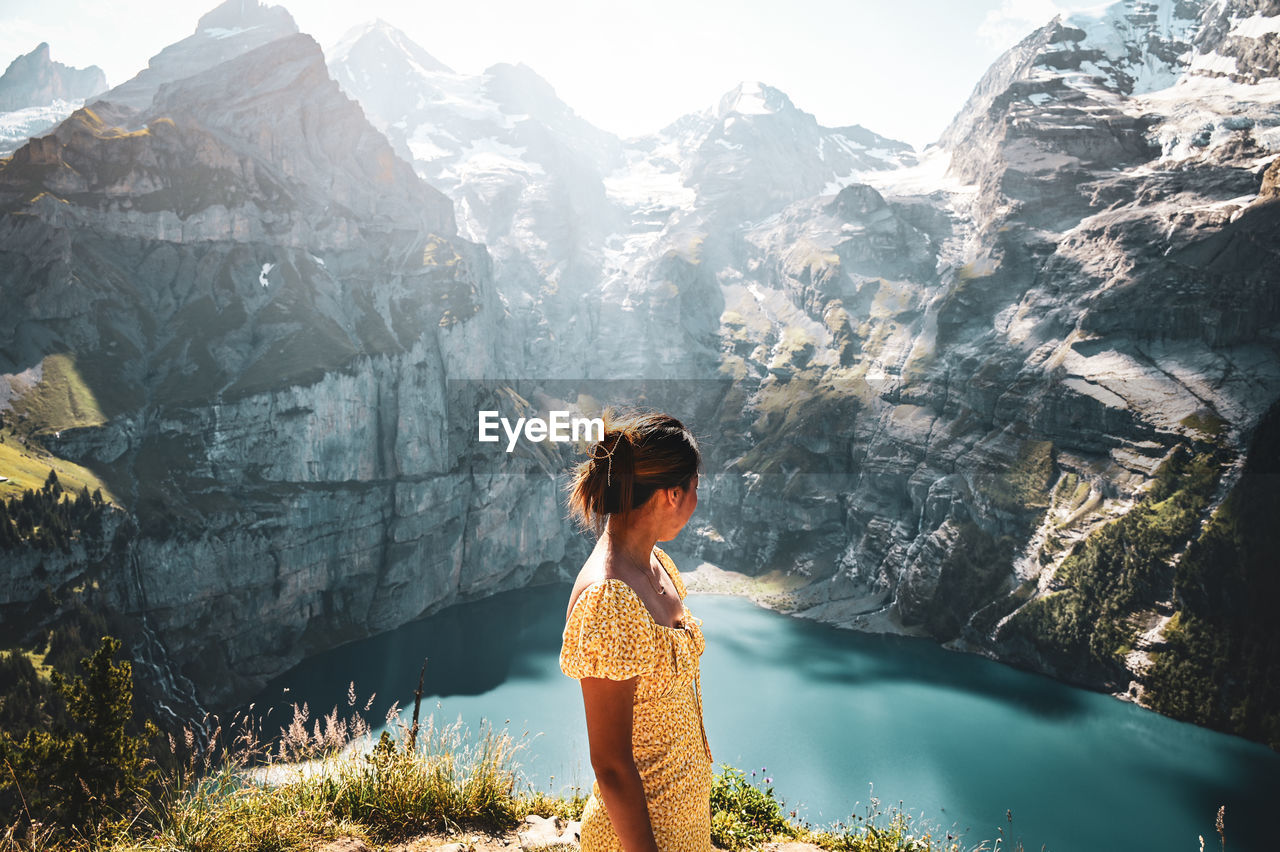 Woman standing on mountain against mountains